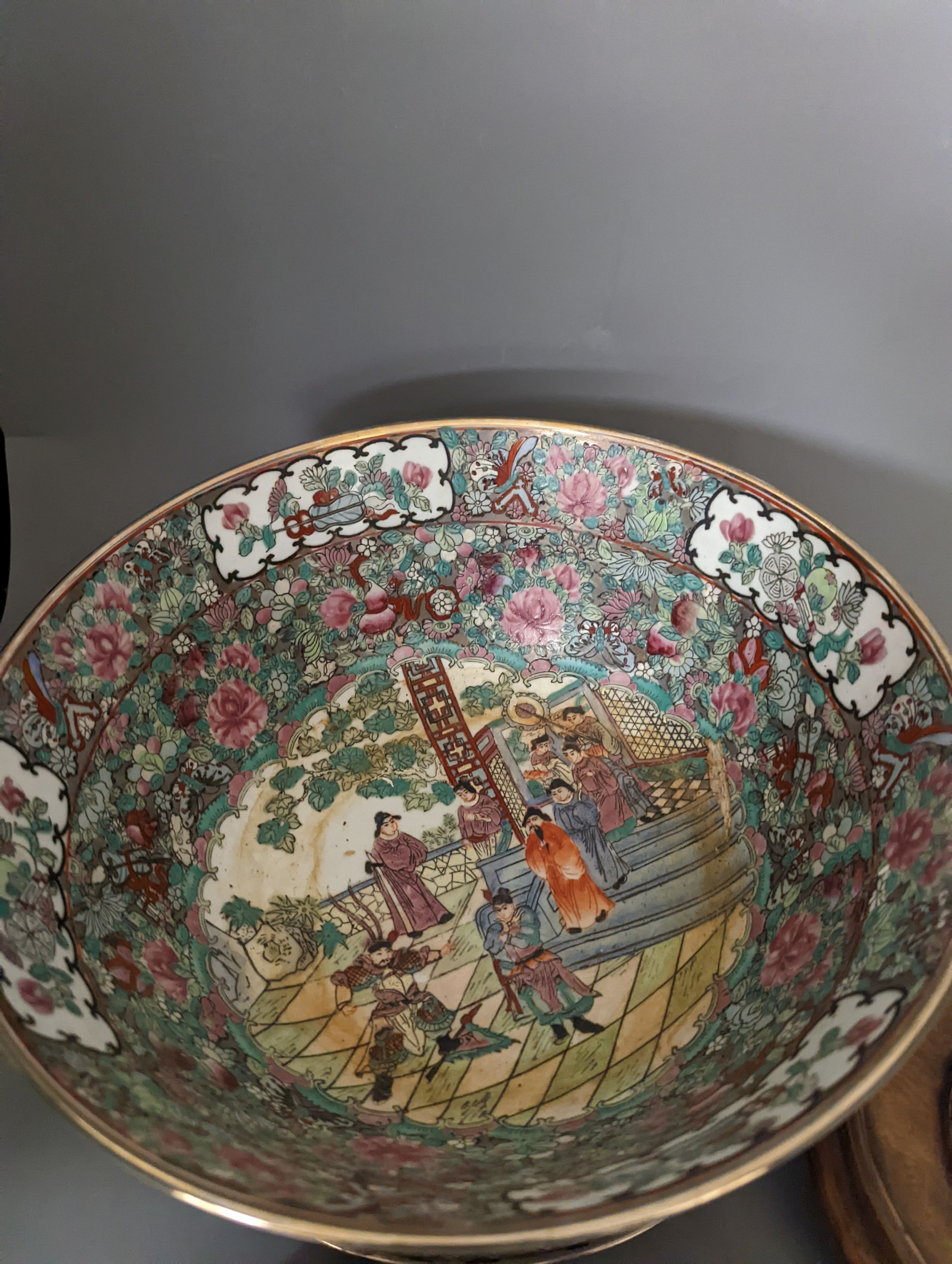 A Chinese famille rose bowl, plate and four stands, bowl 31 cms diameter.